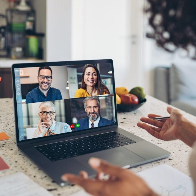 Group of business persons having a video conference